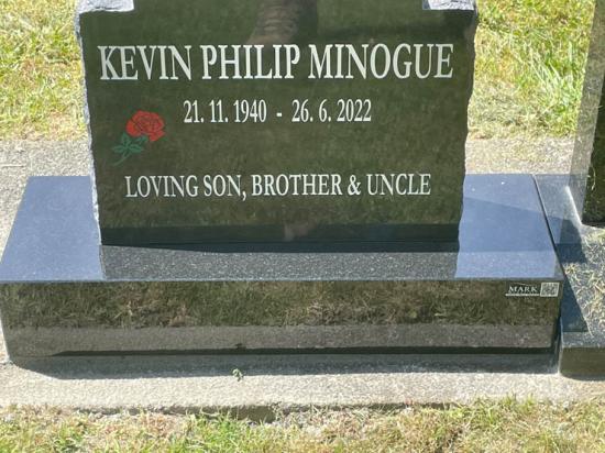 Classic upright headstone with checked top, crafted from polished granite with rough edges and an engraving of a rose by Mark Memorials in Levin, New Zealand.