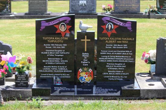 Modern upright double headstone with split low saddle top, crafted from polished granite by Mark Memorials in Levin, New Zealand.