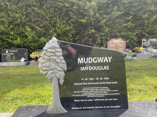 Custom contemporary upright headstone with angled top and a carved tree, crafted from polished granite by Mark Memorials in Levin, New Zealand
