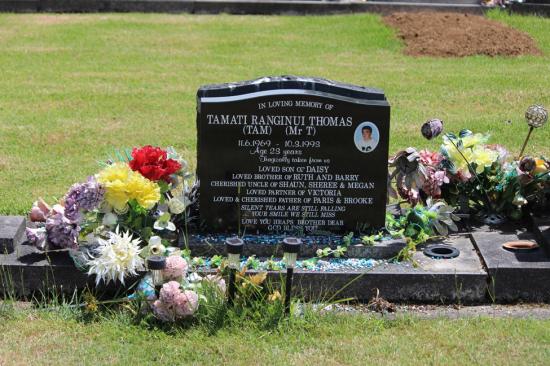 Classic upright headstone with saddle top and colour photograph, crafted from polished granite by Mark Memorials in Levin, New Zealand.