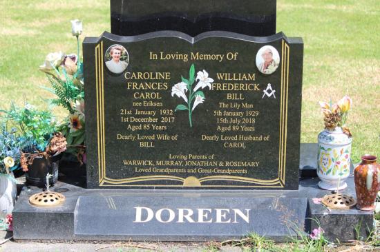 Classic upright double headstone in a book shape, with photos and symbols, crafted from polished granite by Mark Memorials in Levin, New Zealand.