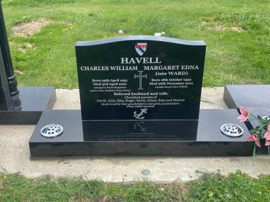 Contemporary upright companion headstone with low saddle top, crafted from polished granite by Mark Memorials in Levin, New Zealand. This includes 3 custom engravings.